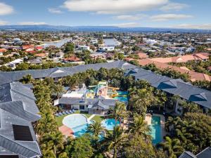 an aerial view of a house with a swimming pool at Turtle Beach Resort in Gold Coast