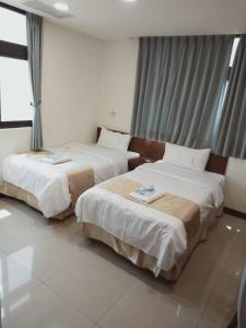 Katil atau katil-katil dalam bilik di Frank B&B
