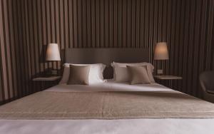 Postel nebo postele na pokoji v ubytování Callistos Hotel & Spa