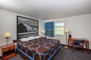 A bed or beds in a room at Super 8 by Wyndham Ida Grove