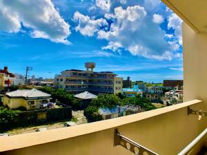 a view of a city from a balcony at robcondロブコンド in Naha