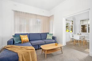 a living room filled with furniture and a couch at Bayview Apartments in Adelaide