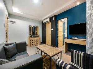 a living room with a couch and a table at Bay Area Suites Manila in Manila