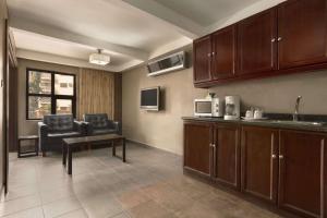 A kitchen or kitchenette at Hawthorn Suites by Wyndham Abuja