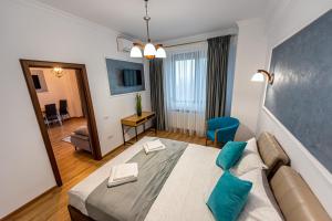 En eller flere senge i et værelse på Sunrise MAMAIA