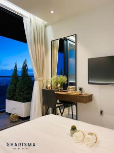 TV a/nebo společenská místnost v ubytování Charisma Hotel Da Lat