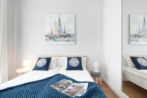 Posteľ alebo postele v izbe v ubytovaní Elite Apartments Garden Gates Premium