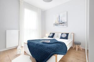 Postel nebo postele na pokoji v ubytování Elite Apartments Garden Gates Premium