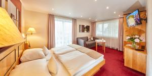 Postel nebo postele na pokoji v ubytování Hotel Riezler Hof