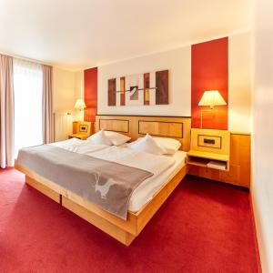 Postel nebo postele na pokoji v ubytování Hotel Riezler Hof