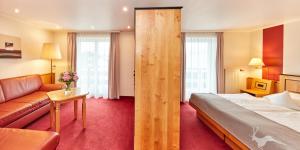 Postel nebo postele na pokoji v ubytování Hotel Riezler Hof