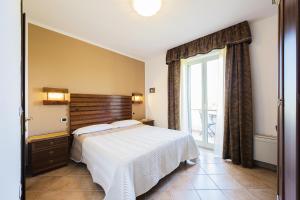 A bed or beds in a room at Agriturismo Il Fontanile