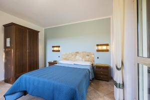 A bed or beds in a room at Agriturismo Il Fontanile