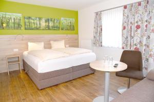 Letto o letti in una camera di Landhotel Reitingblick