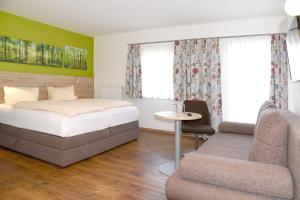 Letto o letti in una camera di Landhotel Reitingblick