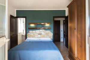 A bed or beds in a room at Agriturismo Il Fontanile