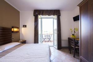 A bed or beds in a room at Agriturismo Il Fontanile
