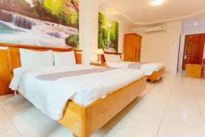 Cama o camas de una habitación en Giang Linh Hotel