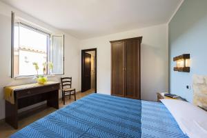 A bed or beds in a room at Agriturismo Il Fontanile