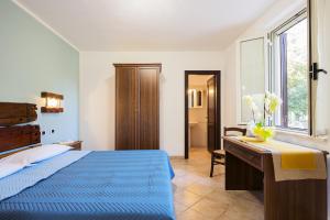 A bed or beds in a room at Agriturismo Il Fontanile