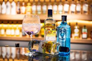 a glass of wine and two bottles of alcohol at Nevada Hotel & Spa in Fethiye