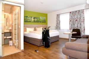 Letto o letti in una camera di Landhotel Reitingblick