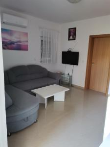 TV a/nebo společenská místnost v ubytování Apartment Mark