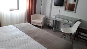 Łóżko lub łóżka w pokoju w obiekcie Hotel Torres Touriño