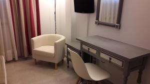 Telewizja i/lub zestaw kina domowego w obiekcie Hotel Torres Touriño