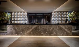 a lobby of a hotel with a marble wall at Grenshotel de Jonckheer in Ossendrecht