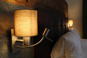 Postel nebo postele na pokoji v ubytování Hotel Rauscher - Das Naturteichparadies