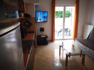 TV a/nebo společenská místnost v ubytování Casa Chiara