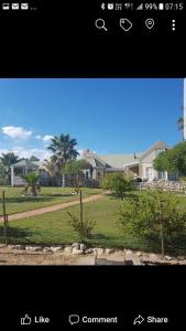 a screenshot of a picture of a yard with houses at Masada Guest House in Langebaan