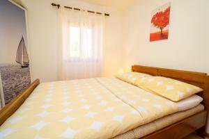 Postel nebo postele na pokoji v ubytování Apartment Nives