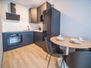 A kitchen or kitchenette at Baltic Apartament