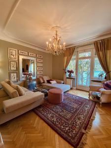 
a living room filled with furniture and a fireplace at Adora Luxury Hotel in Bled
