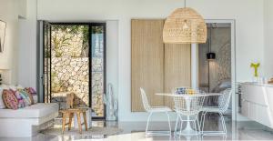 a living room with a table and chairs at Mimi and Coco Villas Corfu in Paramonas