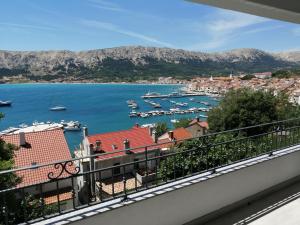 a view of a harbor from a balcony at Apartments Andrea in Baška