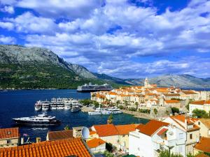 a view of a town with boats in the water at Apartment Marina in Korčula