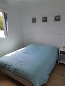 Postel nebo postele na pokoji v ubytování ETABLISSEMENT CHEZ JULES