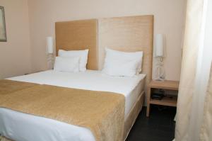 Katil atau katil-katil dalam bilik di Hotel Astoria