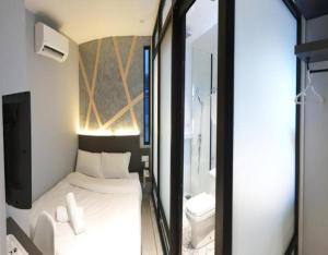 Postel nebo postele na pokoji v ubytování Suite Dreamz Hotel Banting