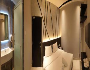 Postel nebo postele na pokoji v ubytování Suite Dreamz Hotel Banting