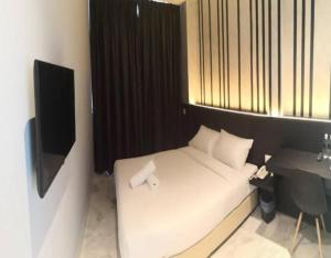 Postel nebo postele na pokoji v ubytování Suite Dreamz Hotel Banting