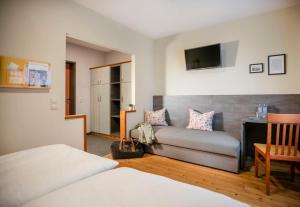 A bed or beds in a room at JUFA Hotel Eisenerzer Ramsau