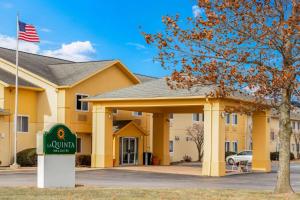 a hotel with an american flag in front of a building at La Quinta by Wyndham Frankfort in Frankfort