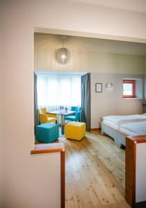 A bed or beds in a room at JUFA Hotel Eisenerzer Ramsau