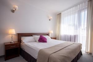 Posteľ alebo postele v izbe v ubytovaní Hotel Jan