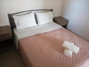 Postel nebo postele na pokoji v ubytování Stelios House
