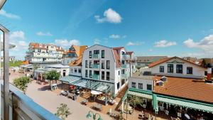 a view of a city street with buildings at Strandnahe, moderne Ferienwohnung auf Wangerooge, Seeluft 34 in Wangerooge +14 photos